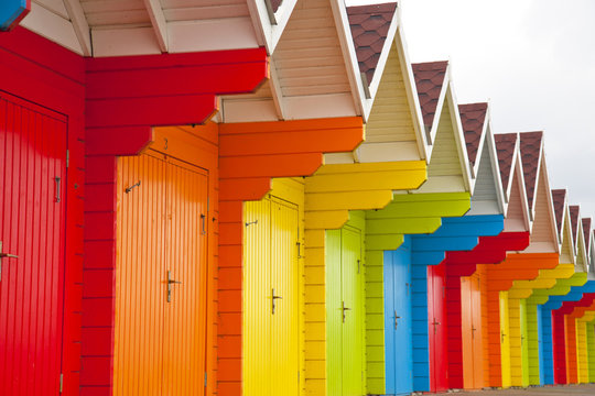 Multicoloured beach huts.