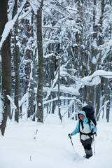 Hiker in winter mountains