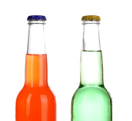 Tasty drinks in bottles isolated on white