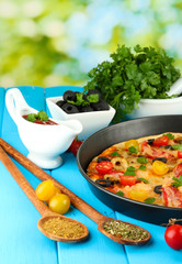 colorful composition of delicious pizza, vegetables and spices