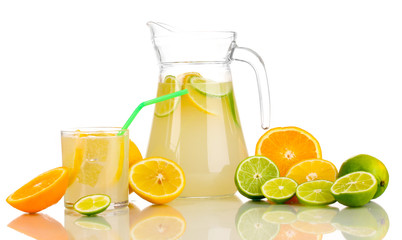 Citrus lemonade in pitcher and glass of citrus around isolated