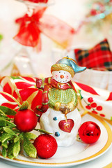 christmas table set with snowman figurine
