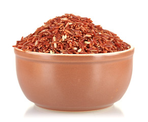 red rice in a brown  plate , isolated on white
