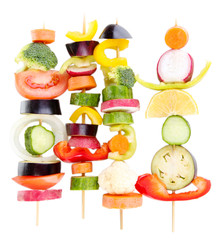 Sliced vegetables on wooden pick isolated on white