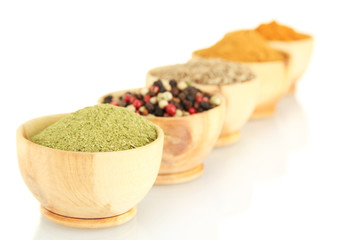 wooden bowls with spices isolated on white