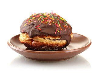 Tasty donut on color plate isolated on white