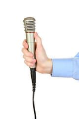Obraz premium Male hand with microphone isolated on white