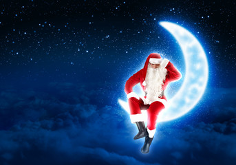 photo of santa claus sitting on the moon