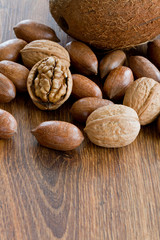Nuts, assortment of nuts on wooden table