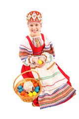 Girl with Easter eggs and a holiday cake