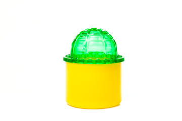 Yellow plastic container with a green cap