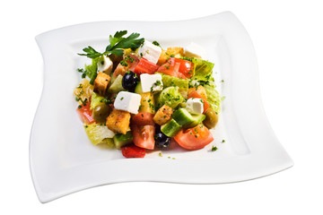 Greek salad on white plate
