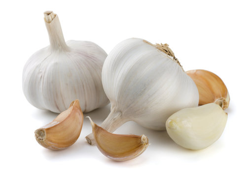 Garlic cloves and bulbs isolated on white