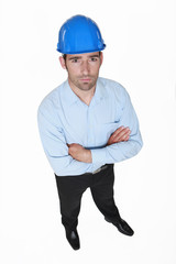 portrait of young foreman standing cross-armed