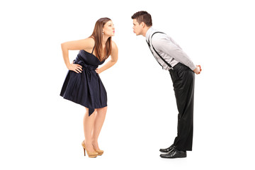 Full length portrait of a heterosexual couple about to kiss