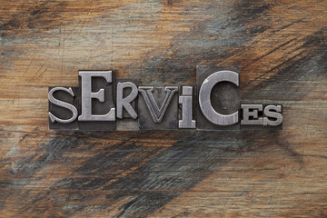services word in metal type blocks