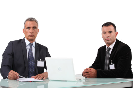 Couple of executives with computer
