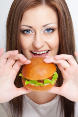 woman going to eat hamburger