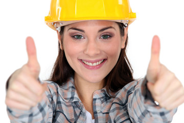 Thumbs up from a female construction worker