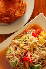 Papaya salad and  chicken fried
