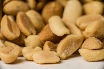Close up shot of peanuts in a pile.