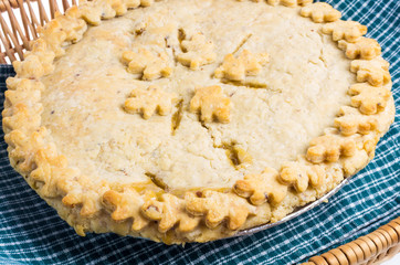 Homemade peach pie with decorated crust