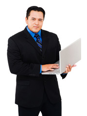 Portrait of businessman working on laptop