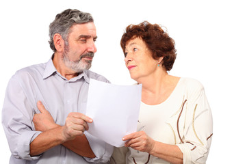 Portrait of senior couple with list of paper, isolated
