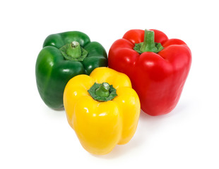 Obraz na płótnie Canvas Three colored peppers vegetables isolated on white background.