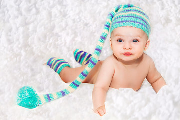 Newborn baby in blue knitted cap