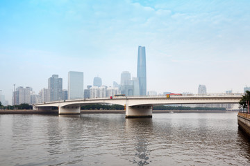 Obraz premium Zhujiang River and modern building of financial district at day
