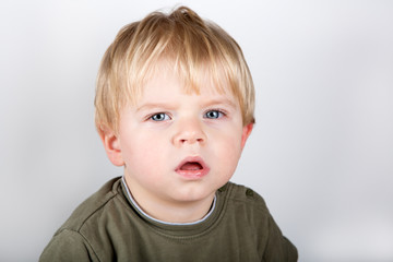 Adorable toddler with blue eyes indoor