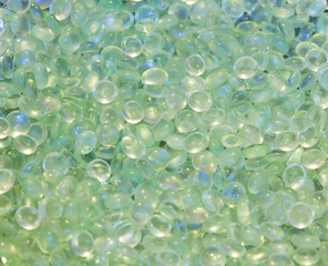 A closeup of many pearls of glass