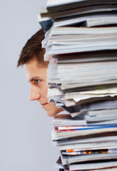 Portrait of handsome man posing on grey background