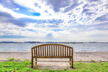 Fototapeta na wymiar Wooden bench with sea view