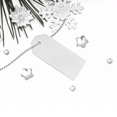 Blank gift tag tied with a silver decoration