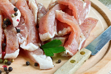 Fresh raw meat on wooden background with pepper
