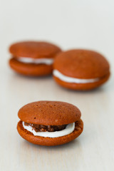 Chocolate marron cookies with nuts and white chocolate cream