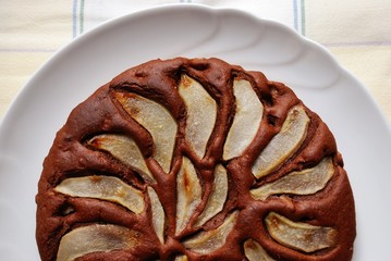 Chocolate cake with sliced pears on the top
