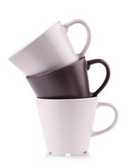 Three coffee cups stacked together on white background