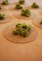 Homemade ravioli pasta filled with herbs and tofu, Italy