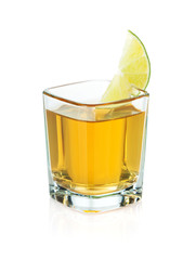 Shot of gold tequila with lime slice