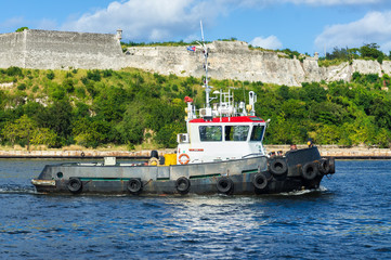 Tugboat  sailing in the bay of Havana