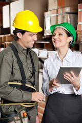 Supervisor With Digital Tablet And Foreman At Warehouse