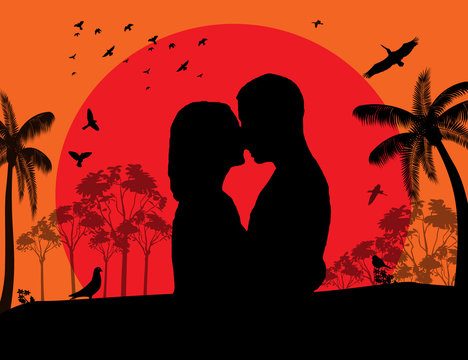 Couple kissing at red sunset on the park