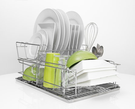 Bright Dishes Drying On Metal Dish Rack