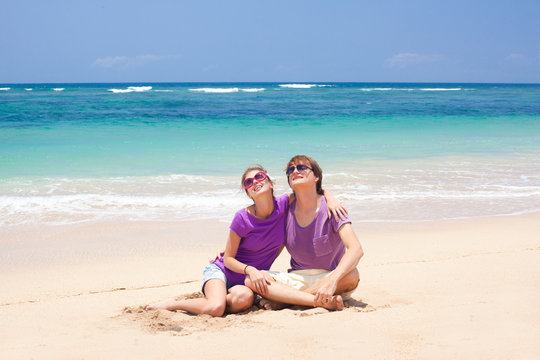 young beautiful couple on tropical bali beach.honeymoon