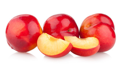 red plums isolated on white