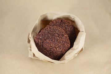 Chocolate and desiccated coconut cookies in a bag
