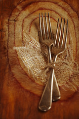 two fork tied by string on old wood, selective focus, shallow do